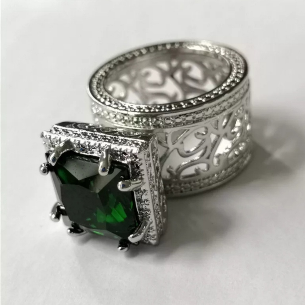 Gold played with green  simulated sapphire ring